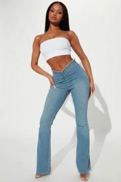 Fashion Nova Workin' It Cinched Low Rise Flare Jean - Medium Wash Flare Jeans